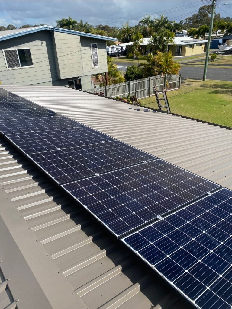 Metal roof with solar panels. The roof was clean and painted.